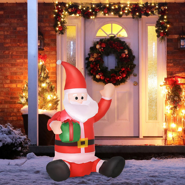 Aufblasbarer Weihnachtsmann sitzend mit Geschenk, 120 cm mit LED-Beleuchtung. Weihnachten Deko Luftfigur